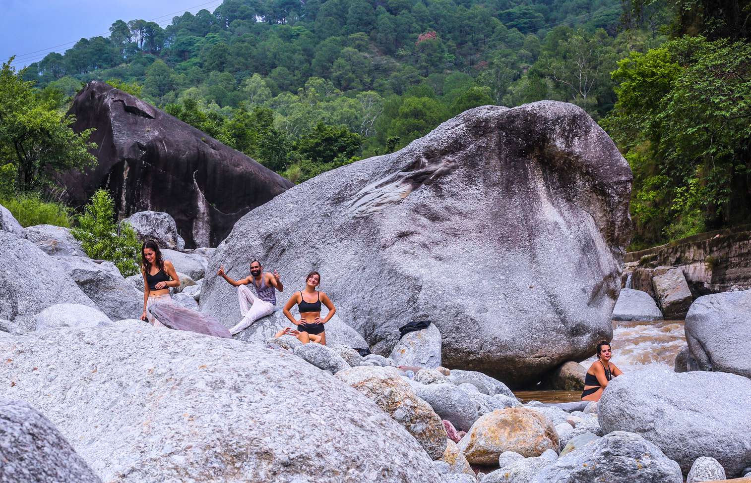 Meditating alone on river boulders