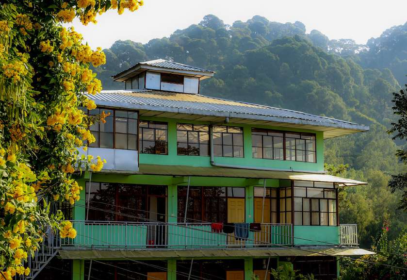 Standing yoga postures with rope wall